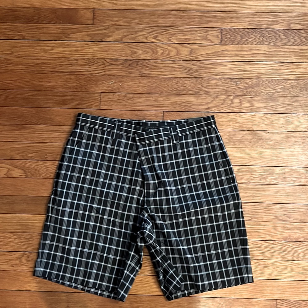 Black & white check golf shorts.